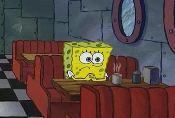 A cartoon of a yellow sea sponge with large blue eyes, known as SpongeBob SquarePants, sits alone at a dinner table.