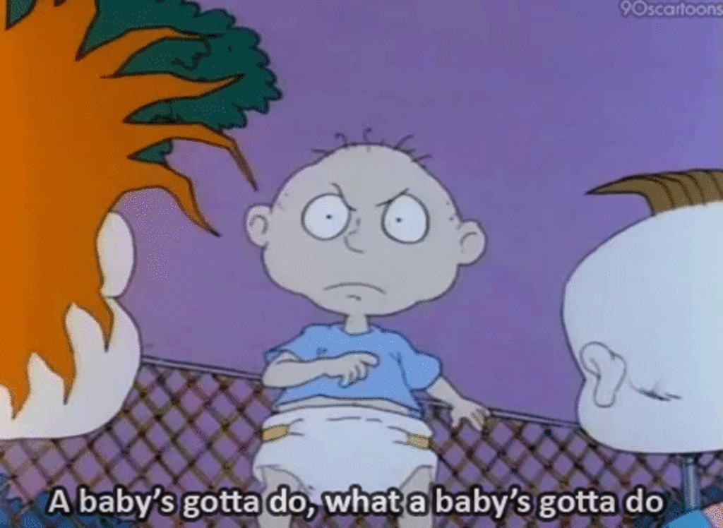 On the left a small child with red hair, and on the right another baby looks at a bald baby dressed in a blue t-shirt and white diaper in the middle of the image. The text below the image reads" a baby's gotta do, what a baby's gotta do".